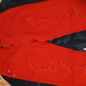 Red pair of denim stretch jeans